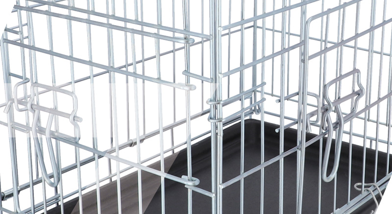 La jaula plegable para perros ZOLIA KODA tiene en el fondo una bandeja de plástico negra